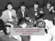 Four musicians at press conference with quote