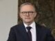 Man in suit and tie with glasses