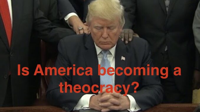Seated man bowing head; overlay asks about theocracy Seated man bowing head; overlay asks about theocracy