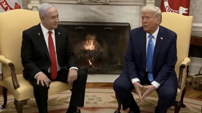 Two men in suits seated by fireplace Two men in suits seated by fireplace