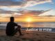 Person on beach sunset with 'Justice is mine'