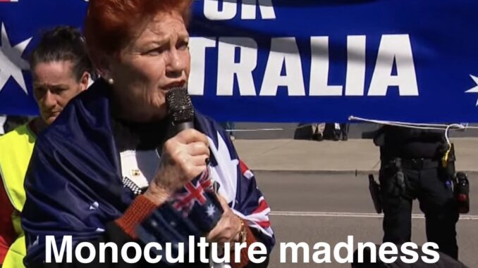Person speaking into microphone at protest Person speaking into microphone at protest
