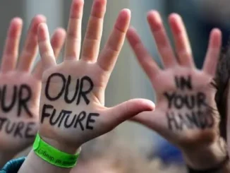 Raised hands with "Our Future" protest message