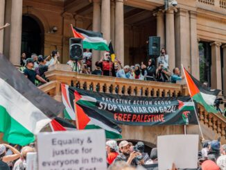 Pro-Palestine rally with banners and flags