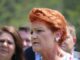 Portrait of red-haired woman in crowd