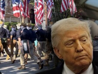 Close-up of man over marchers with American flags