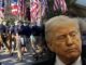 Close-up of man over marchers with American flags