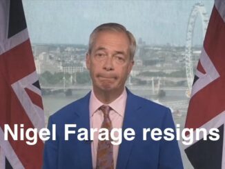 Man in blue suit with British flags