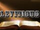 Open Bible titled Leviticus illuminated by light