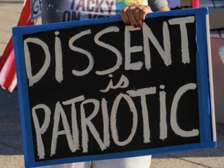 Protest sign reading "Dissent is Patriotic