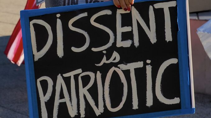 Protest sign reading "Dissent is Patriotic